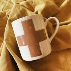 CREATIVE COOP Swiss Cross Mug - Cream + Brown